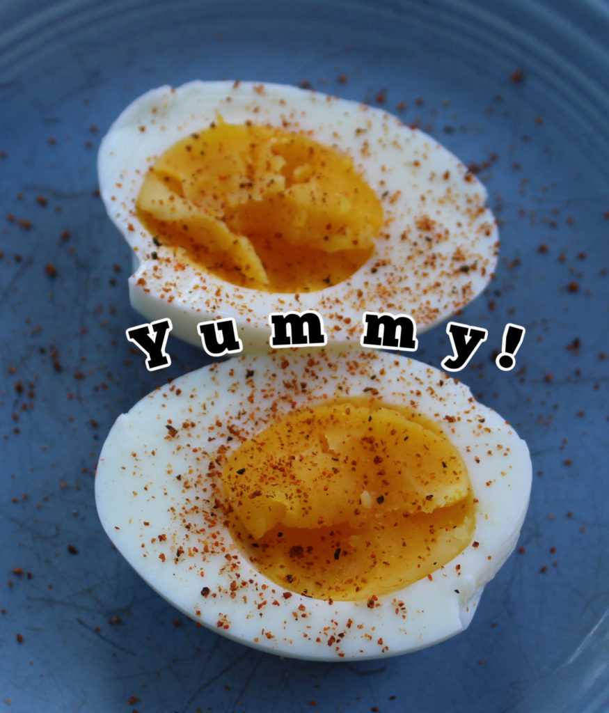 yummy  perfect 5 minute hard boiled eggs halved with spicy Cajun seasoning on top