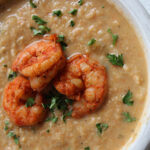 overhead picture of cauliflower shrimp bisque with seasoned shrimp on top