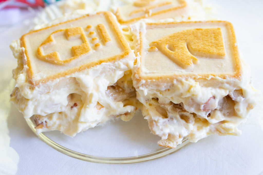 Single serving of the best banana pudding on a clear plate 