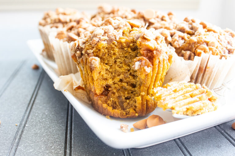 closeup side view of pumpkin muffin with bite out of it