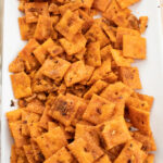 baked feisty cheese snack crackers on a white plate