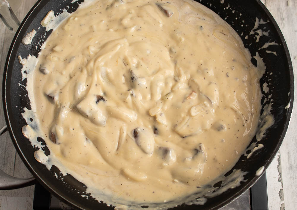 throughly mixed mushroom, onion cream sauce in a skillet.